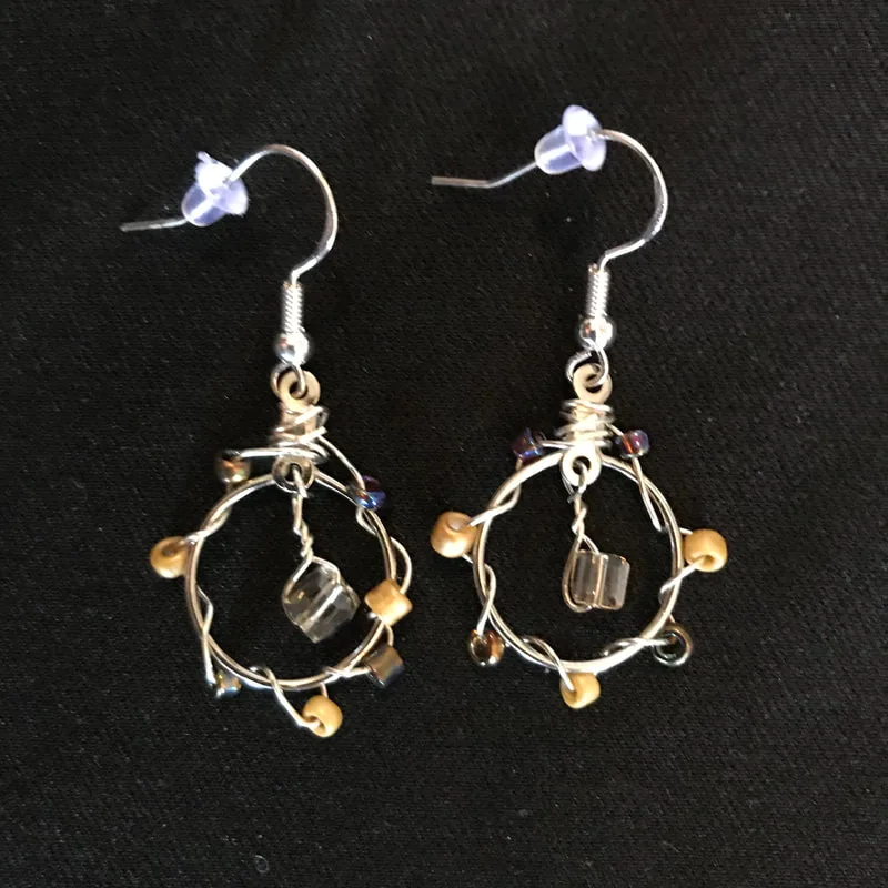 small circle earrings with yellow, brown, and gold beads